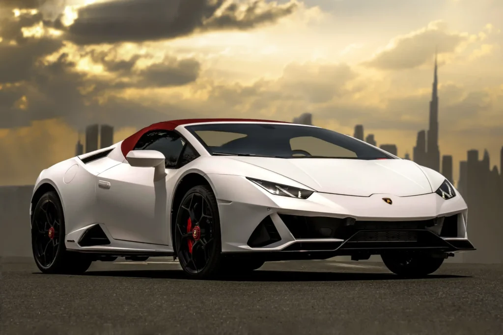 Lamborghini Huracán Spyder automotive photography against the Dubai skyline at sunset